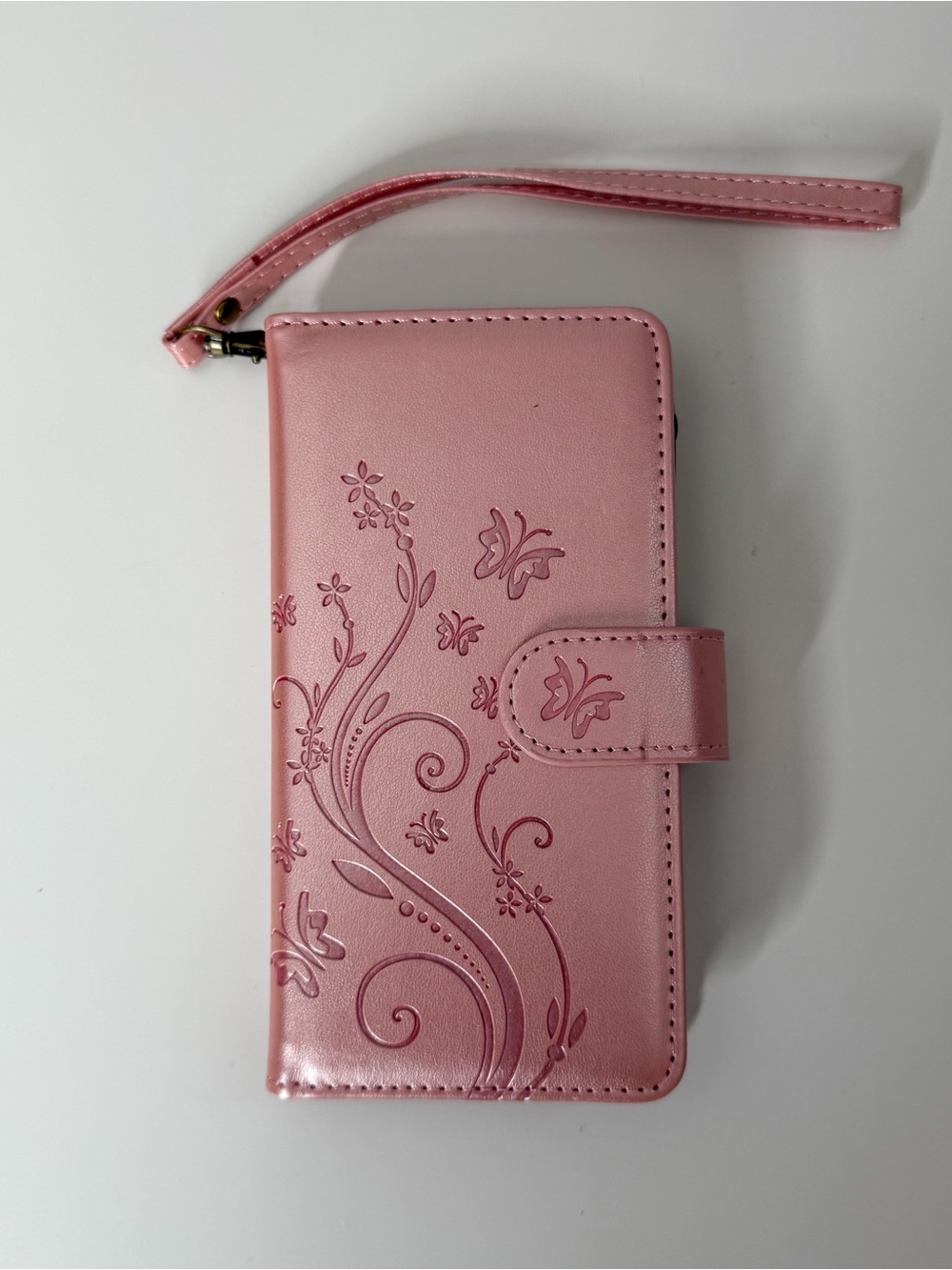 Pink Floral Wallet iPhone 14 Case with Wrist Strap.